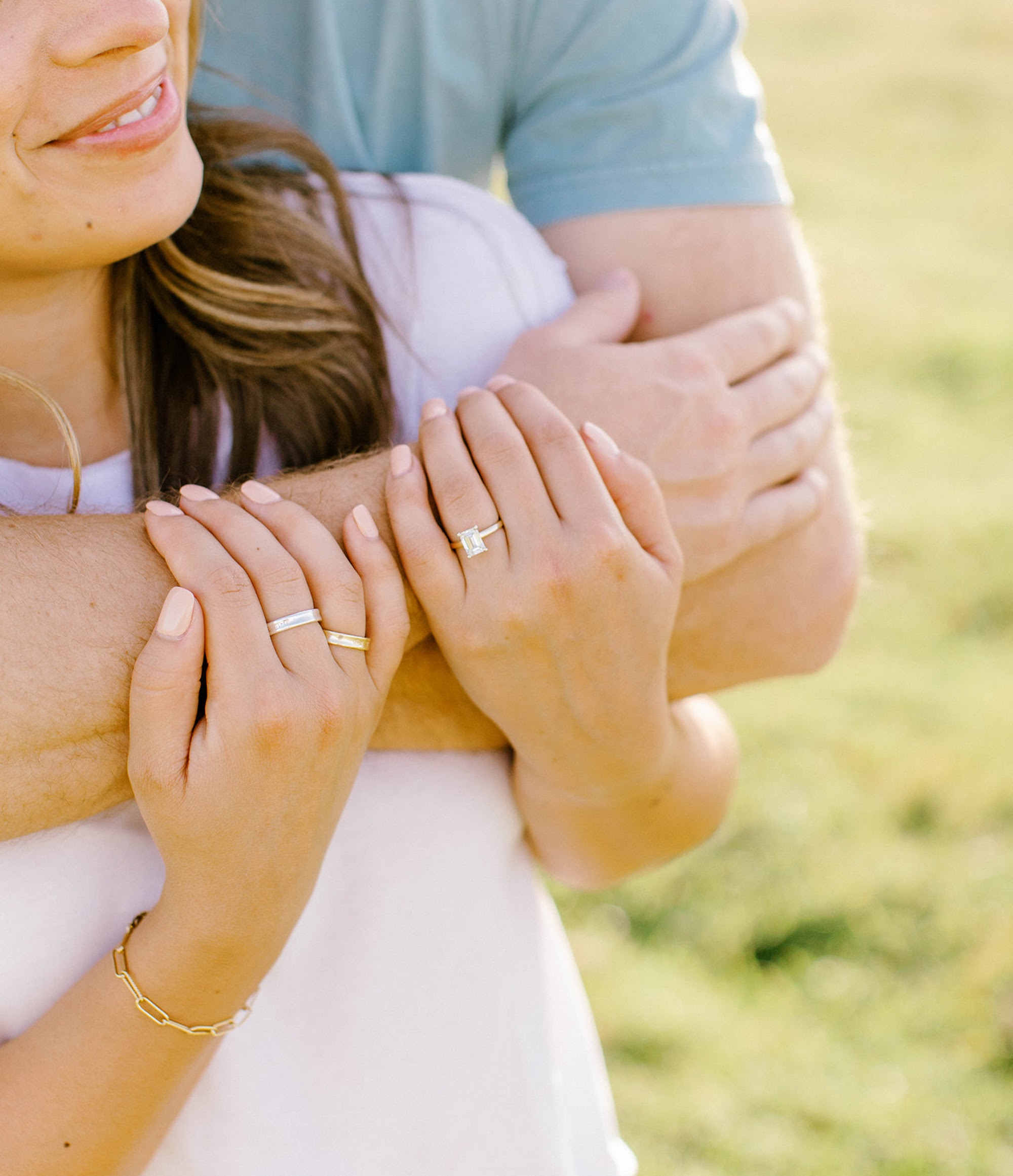 A close detail of a couple showing their rings